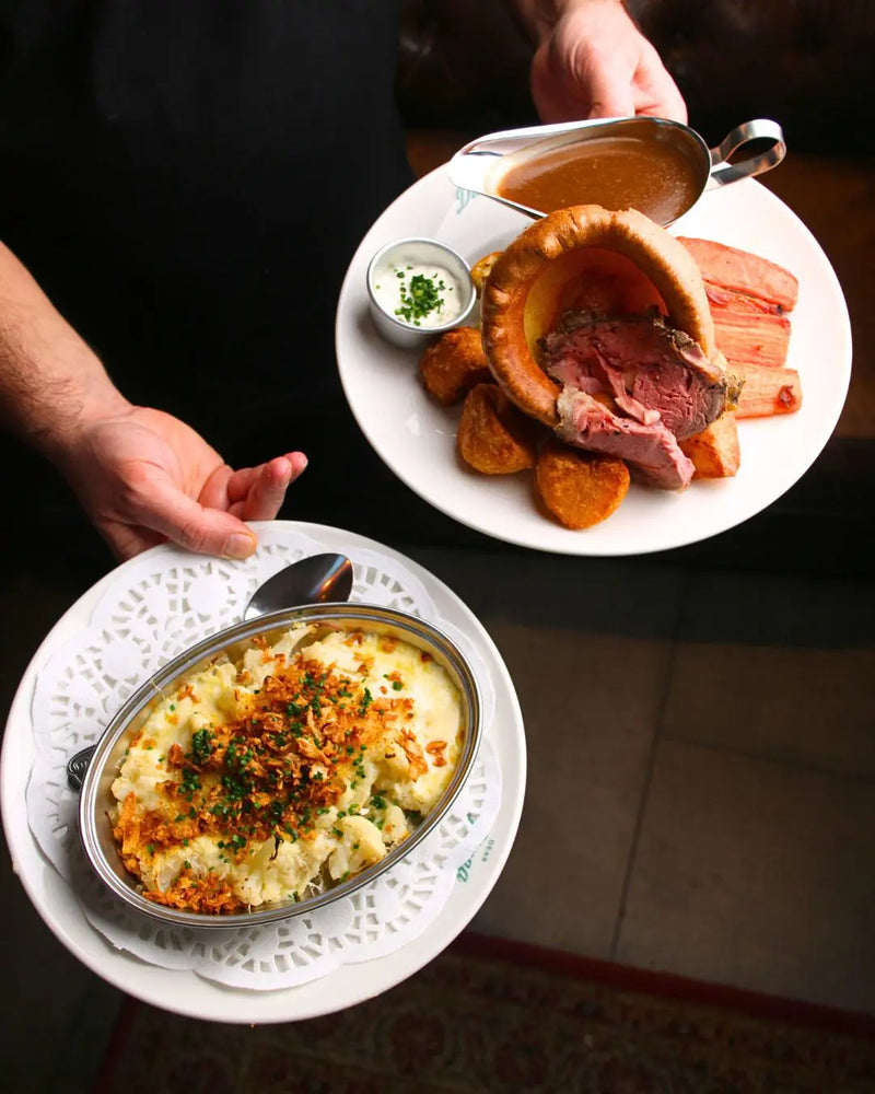 Sunday Roast at Dear Diana – 32-day dry-aged beef prime rib with Yorkshire pudding, roast potatoes, carrots, house gravy and cauliflower cheese side